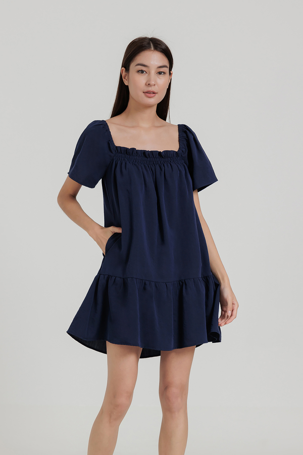 Ainsley Gathered Drop Hem Dress